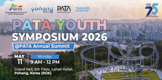 Youth gather under the PATA flag